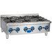 A close-up of a Globe stainless steel countertop gas hot plate with blue knobs.