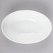 A white Libbey porcelain infinity bowl on a white background.