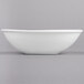 A white Libbey Chef's Selection porcelain bowl on a white surface.