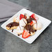 A Libbey Aluma White porcelain tray with chocolate covered strawberries and chocolate desserts.