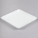 A white square Libbey porcelain tray with a small handle.