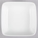 A white square bowl with a white rim.