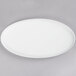 A Libbey Aluma White Porcelain oval tray on a gray surface.