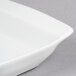 A Libbey Aluma White porcelain handled tray with a white rim.