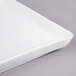A Libbey white porcelain tray with a small handle.
