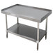 An Advance Tabco stainless steel equipment stand with two shelves.