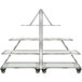 A stainless steel rolling buffet cart with clear acrylic shelves.