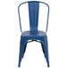 A Flash Furniture distressed antique blue metal chair with a vertical slat back.