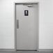 A grey bathroom door with a black and white Thunder Group ADA Men's Restroom Sign with Braille on it.