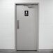 A grey door with a Thunder Group ADA women's restroom sign on it.