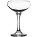 An Acopa clear glass coupe wine glass with a stem.