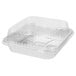 A clear plastic container with a Durable Packaging foil cake pan and lid inside.