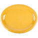 A close up of a yellow oval GET Diamond Mardi Gras platter.