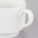 A close-up of a Homer Laughlin bright white tea cup with a handle.