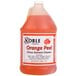 A Noble Chemical 1 gallon bottle of orange peel citrus concentrated solvent cleaner on a counter.
