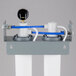 The Manitowoc Arctic Pure water filtration system with blue and white hoses.