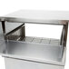 A stainless steel APW Wyott hot dog steamer on a counter.