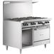 A large stainless steel Garland range with 8 burners, a standard oven, and a storage base.