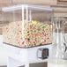A white Zevro dry food dispenser filled with cereal.