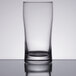 A Libbey highball glass on a table.