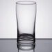 A close-up of a Libbey highball glass on a table.