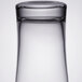 A close-up of a Libbey highball glass with a white background.