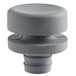 A grey plastic knob with a round top.
