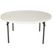 A white Lifetime round folding table with black legs.