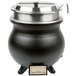 A black APW Wyott soup kettle with a silver lid on a counter.