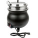 An APW Wyott countertop soup kettle with a black pot and silver lid.