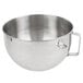 A silver KitchenAid stainless steel mixing bowl with a handle.