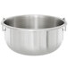 A Vollrath stainless steel bowl with handles.