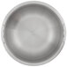 A close-up of a silver stainless steel pan with a circular design and a handle.