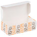 An open white Thanksgiving candy box with orange and white designs.