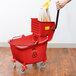 Lavex Janitorial 35 Qt. Red Mop Bucket & Side Press Wringer Combo Main Thumbnail 6
