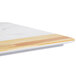 An Elite Global Solutions Sierra melamine serving board with faux alder wood and Carrara marble design.