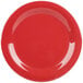 A close-up of a red plate with a white curved line.