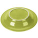 A green Fiesta china rim soup bowl with a white rim.