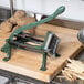 A Choice Prep potato cutter on a cutting board.