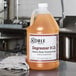 A one-gallon container of Noble Chemical concentrated heavy duty degreaser for industrial use.