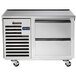A stainless steel Traulsen refrigerated chef base on wheels.