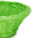 A green polyweave round bread basket with a handle.
