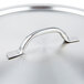 A Vollrath stainless steel domed cover with a metal handle.