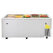 A Turbo Air refrigerated buffet table with a variety of food in it.