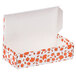 A white 1 lb. candy box with orange leaves on it.