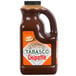 A plastic jug of TABASCO Chipotle Pepper Hot Sauce.