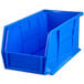 A blue plastic Metro stack bin with a handle on a white background.