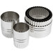 A set of Ateco stainless steel double-sided round pastry cutters in a metal container.