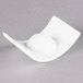 A white Arcoroc rectangular porcelain bowl with a wavy edge.