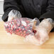 A person holding a LK Packaging plastic bag of berries.